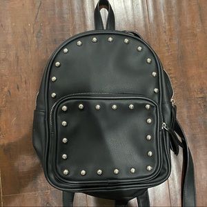 Mini black studded backpack